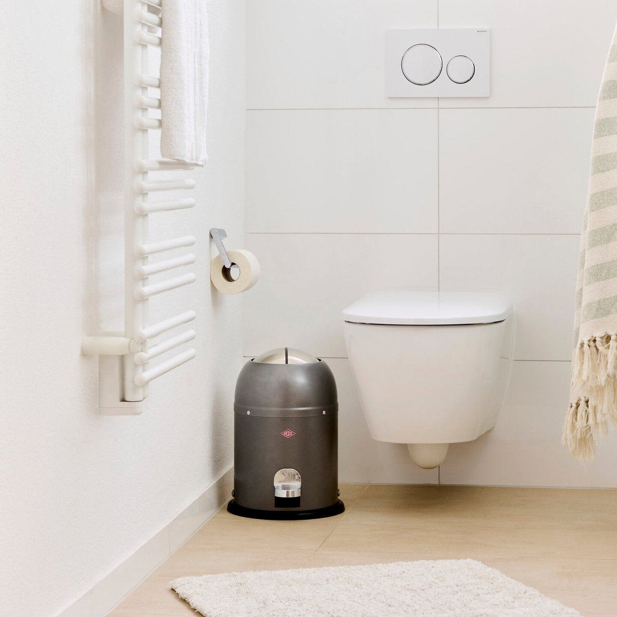 Wesco Mini Master 6L pedal bin in a white bathroom next to the toilet