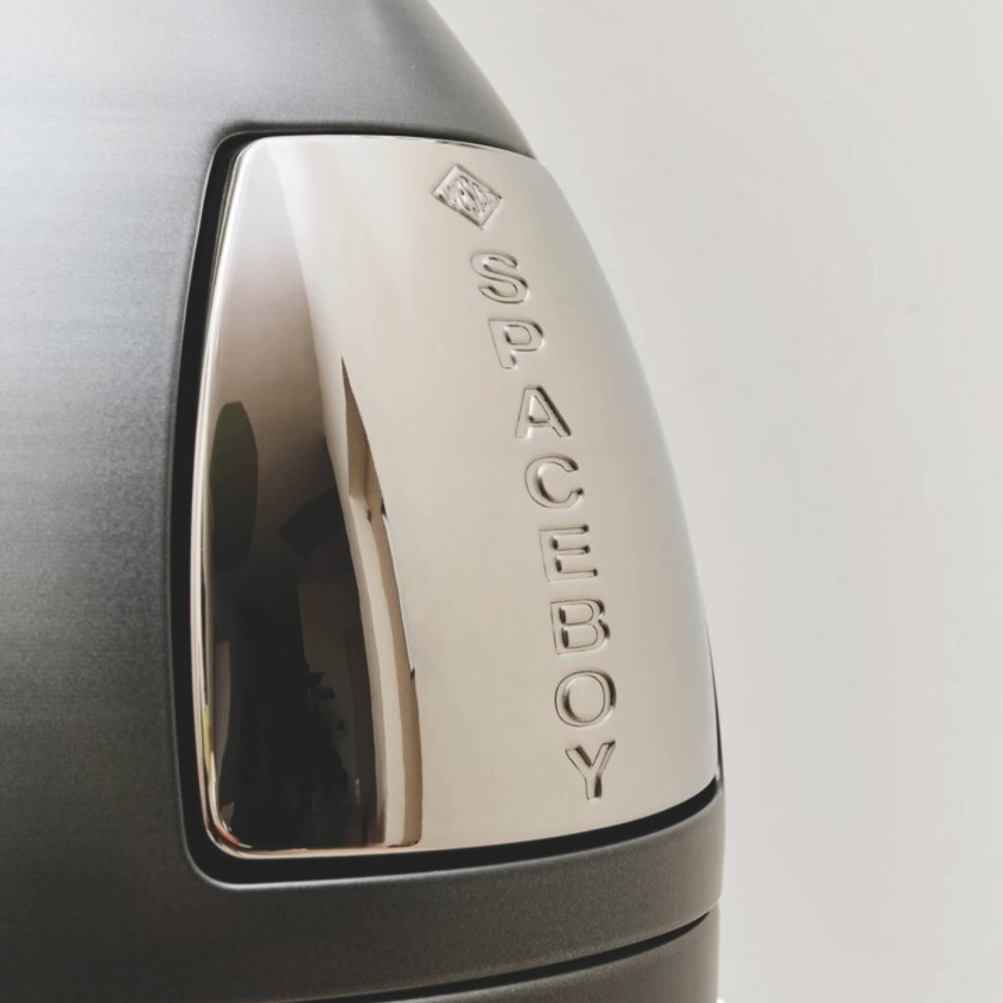 Close-up of a Chrome Push flap with 'SPACEBOY' branding.