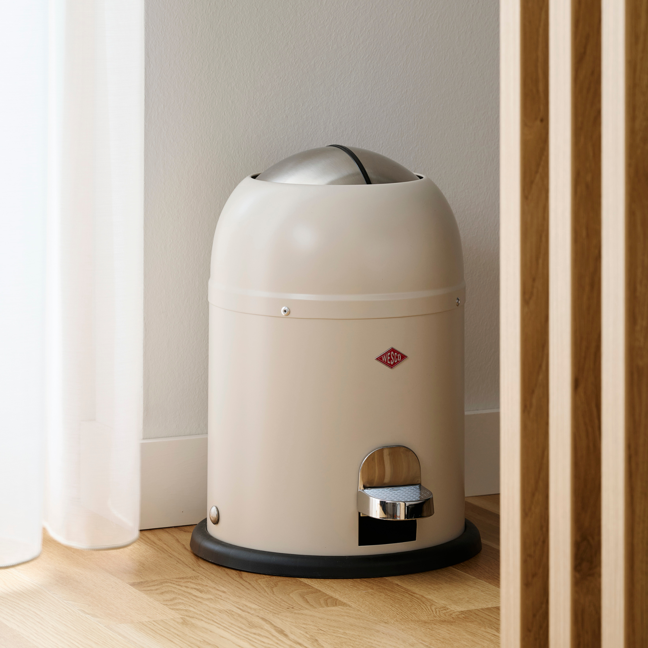 Wesco Mini Master Bathroom waste bin 6L in Matt Sand on Wooden flooring and White Background