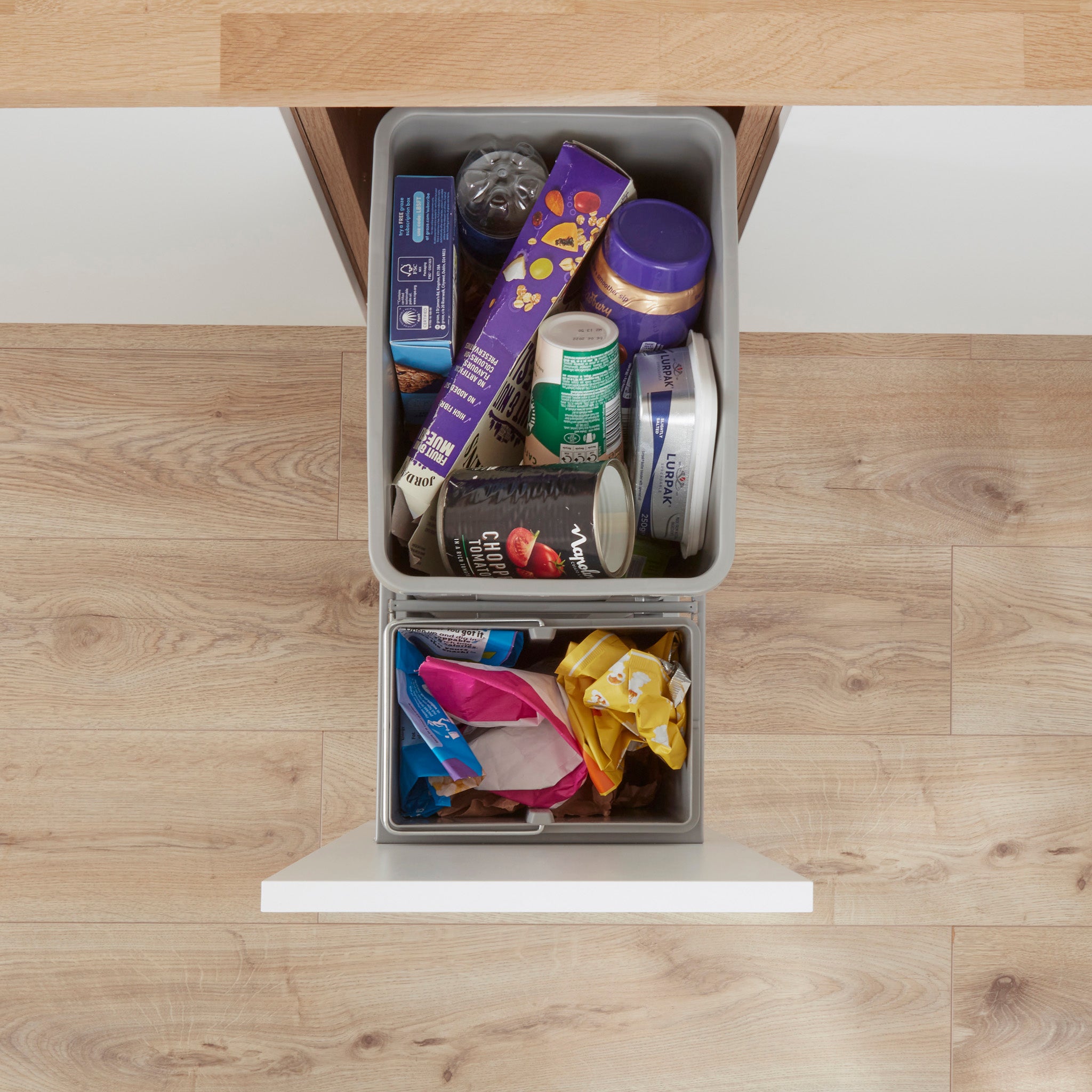 Wesco 300AZ pull-out waste bin system from above with recycling waste in 2 compartments.