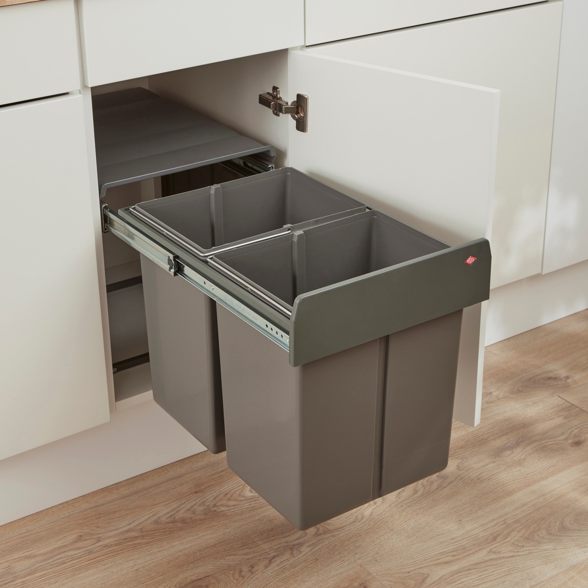 Orion Grey Wesco Profiline Double Master 40L waste bin mounted inside a kitchen cabinet, showing two separate bin compartments.