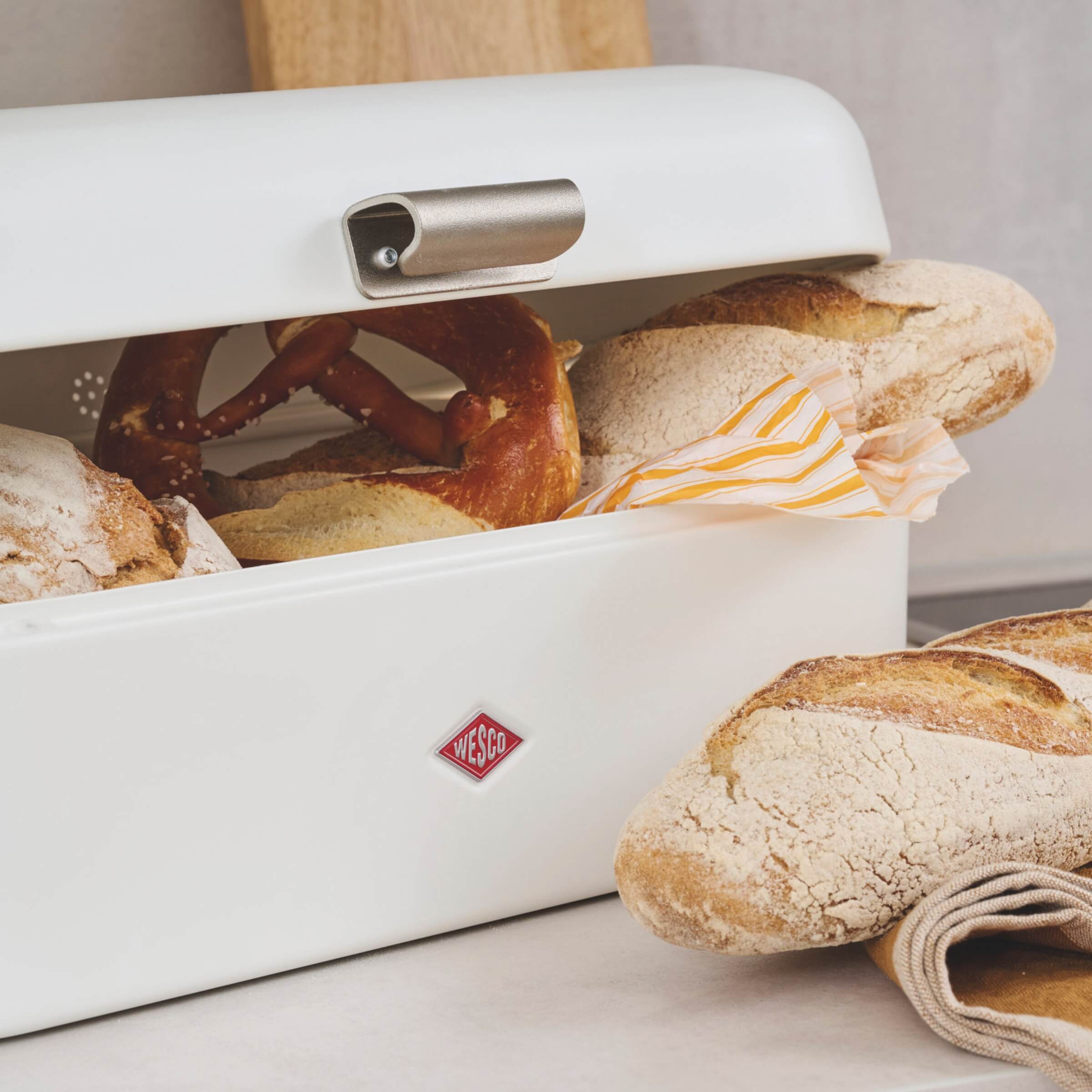 Wesco Grandy Bread bin in white filled with fresh bread