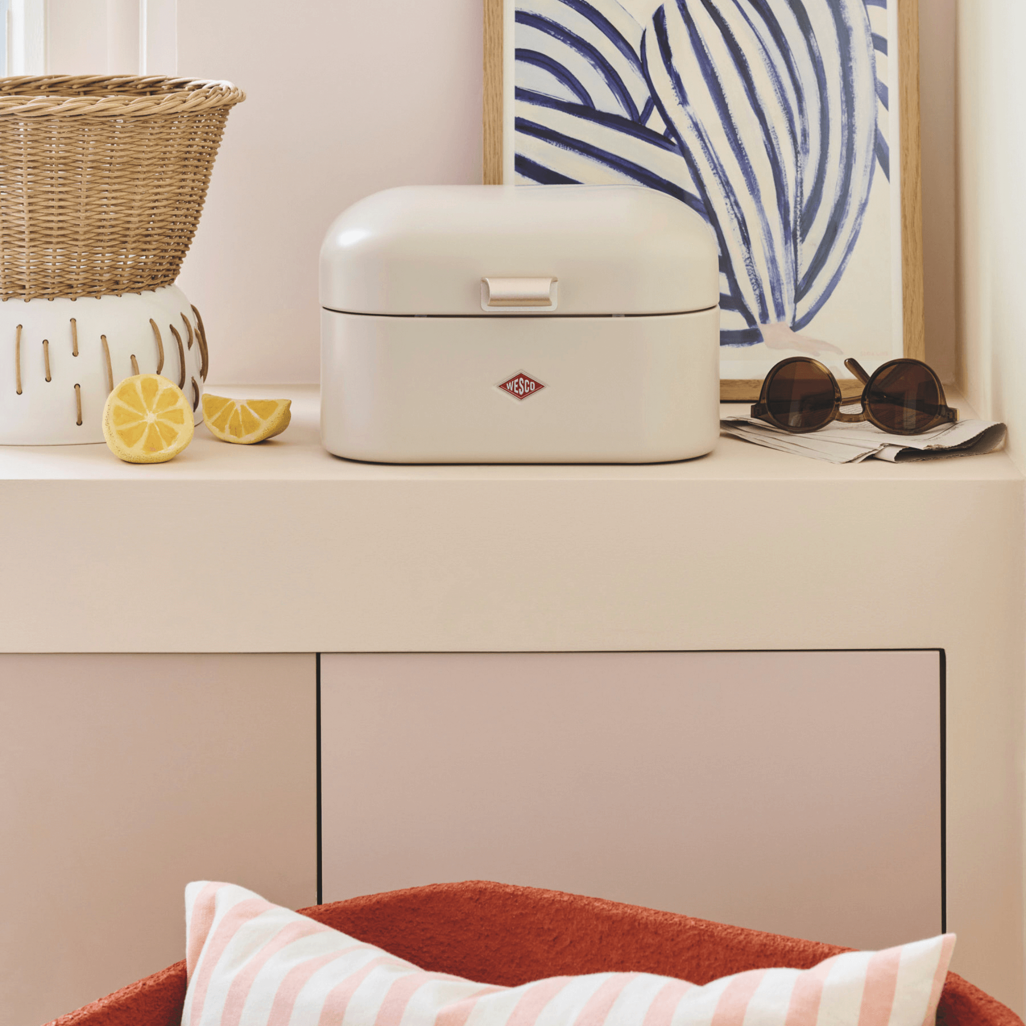 Matt Sand bread bin on a kitchen counter with decorative elements