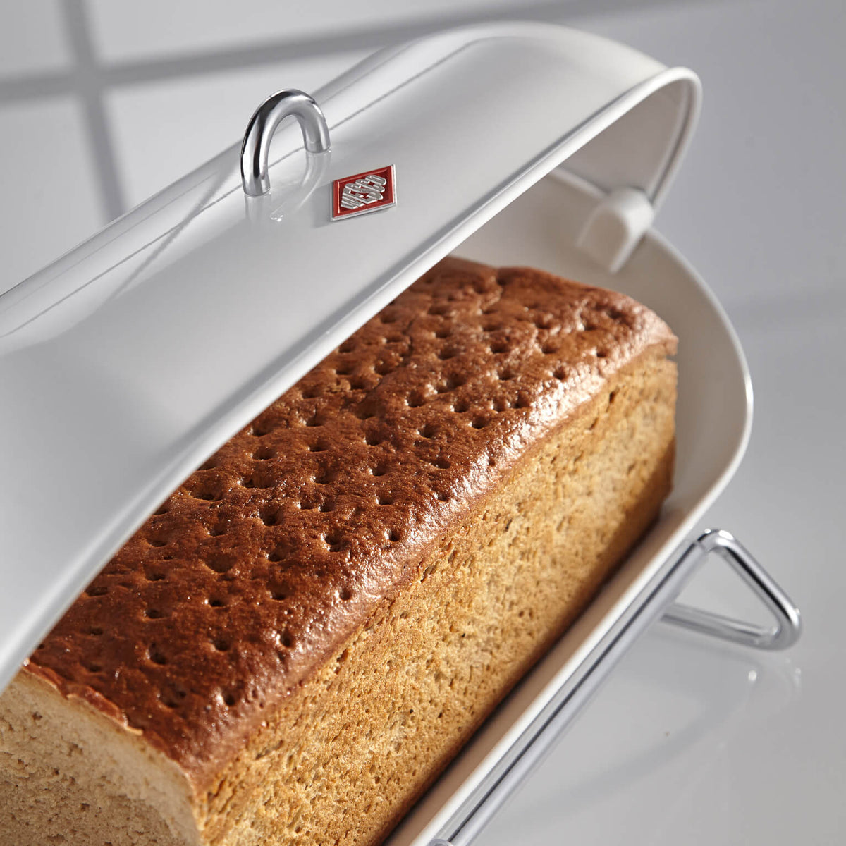 White Wesco Breadboy open roll top with bread inside. 