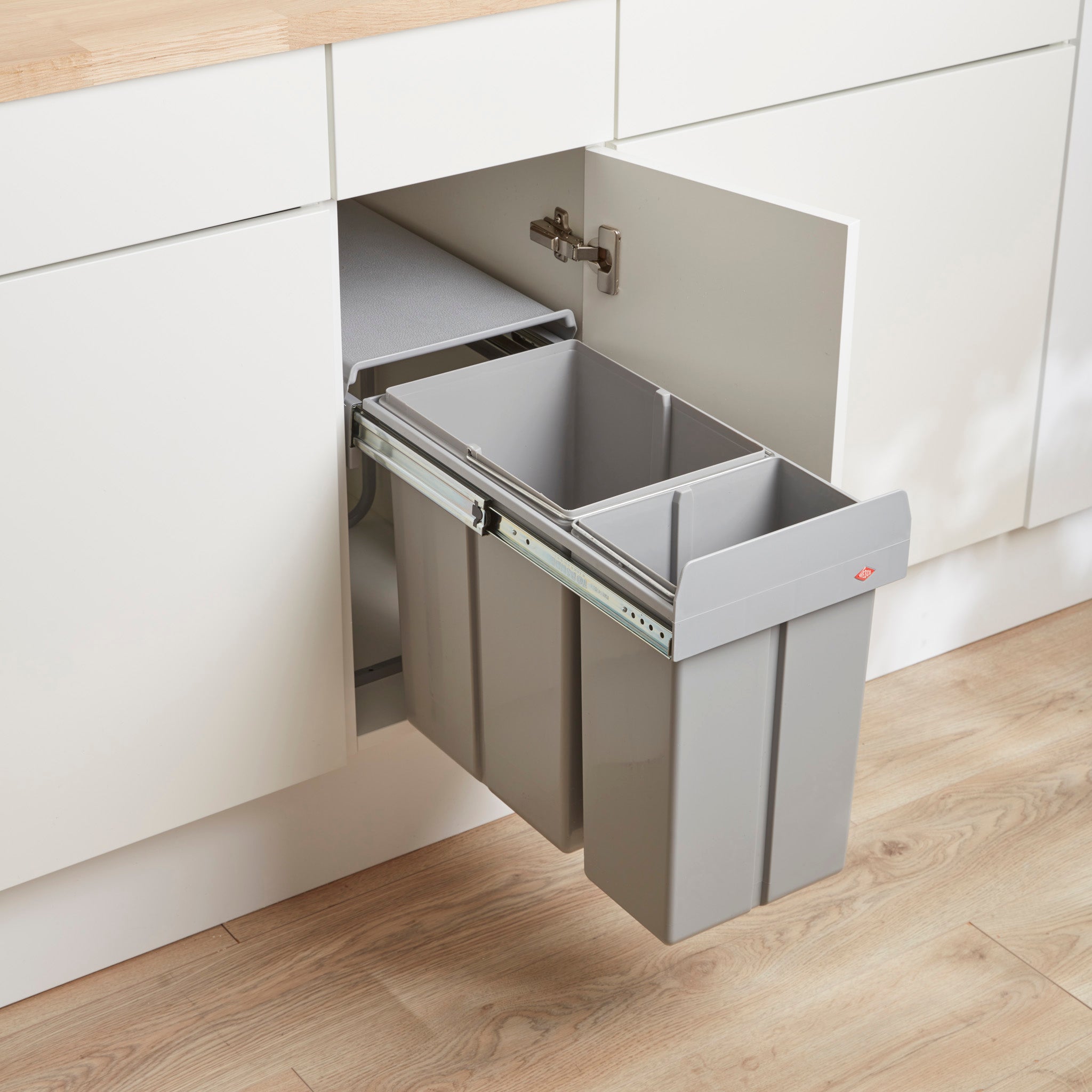 Wesco traditionline Bio-Double 30L waste bin system installed inside a kitchen cabinet, featuring two separate compartments.