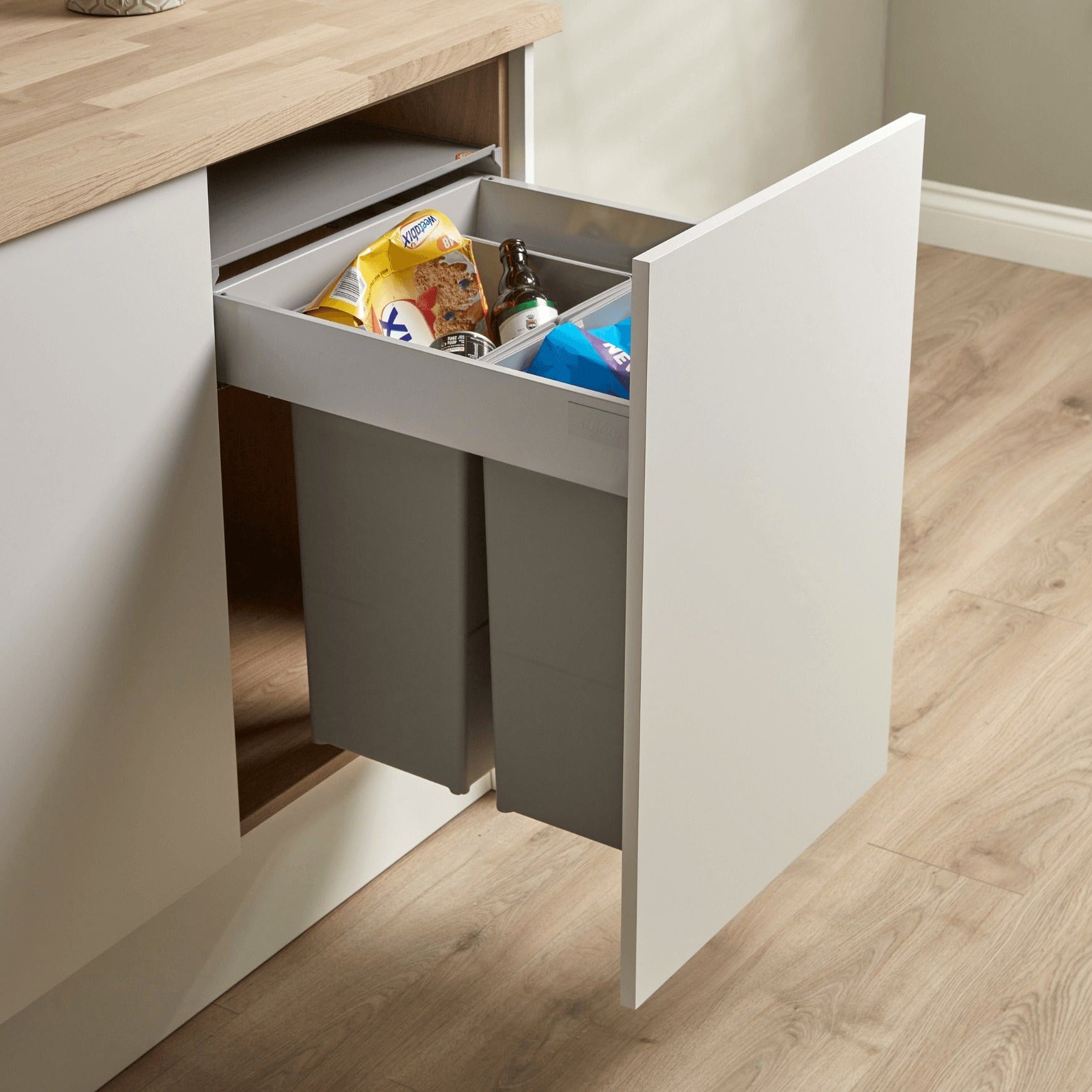 Wesco Pullboy Z 500mm 2 x 29L inner bins in light grey filled with recycling. Fitted within a kitchen cabinet. 